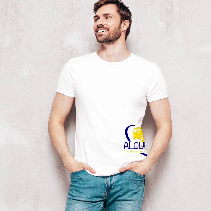Portrait of handsome smiling stylish hipster lambersexual model. Sexy man dressed in T-shirt and jeans. Fashion male isolated on blue wall in studio